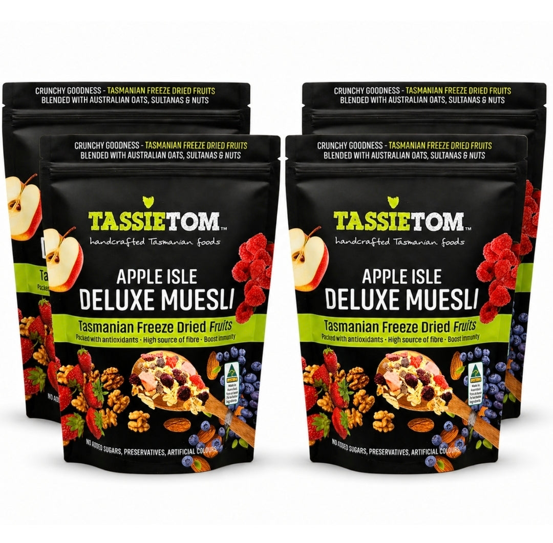 Four packages of Tassie Tom Apple Isle Deluxe Muesli on a white background