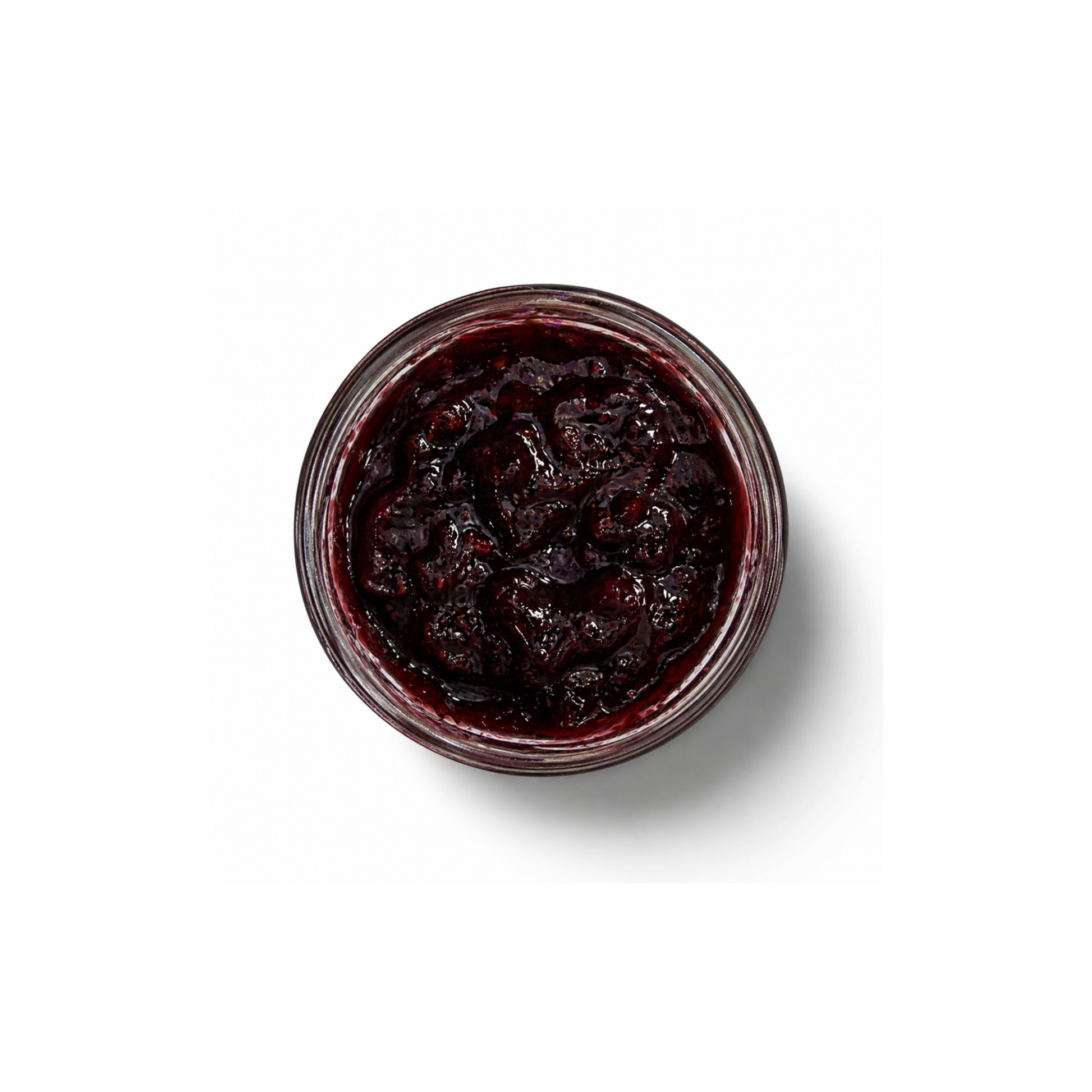 Open blackberry jam jar aeriel view of texture