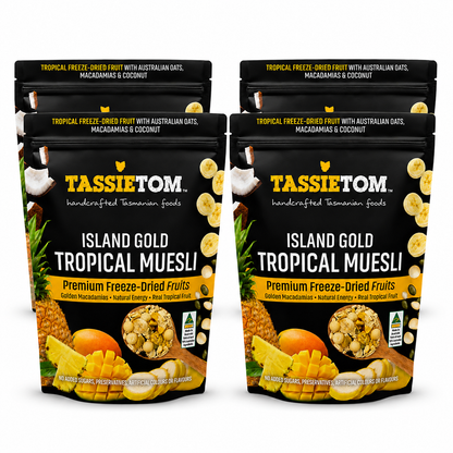 Four packages of Tassie Tom Island Gold Tropical Muesli on a white background