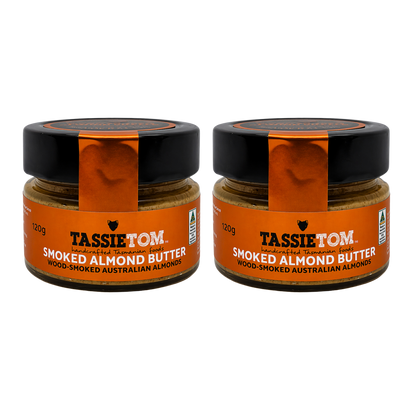 Two jars of TassieTom smoked almond butter on a white background