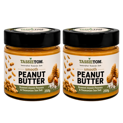 Two jars of TassieTom smooth peanut butter on a white background