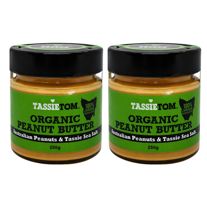 Two jars of Tassie Tom organic peanut butter on a white background