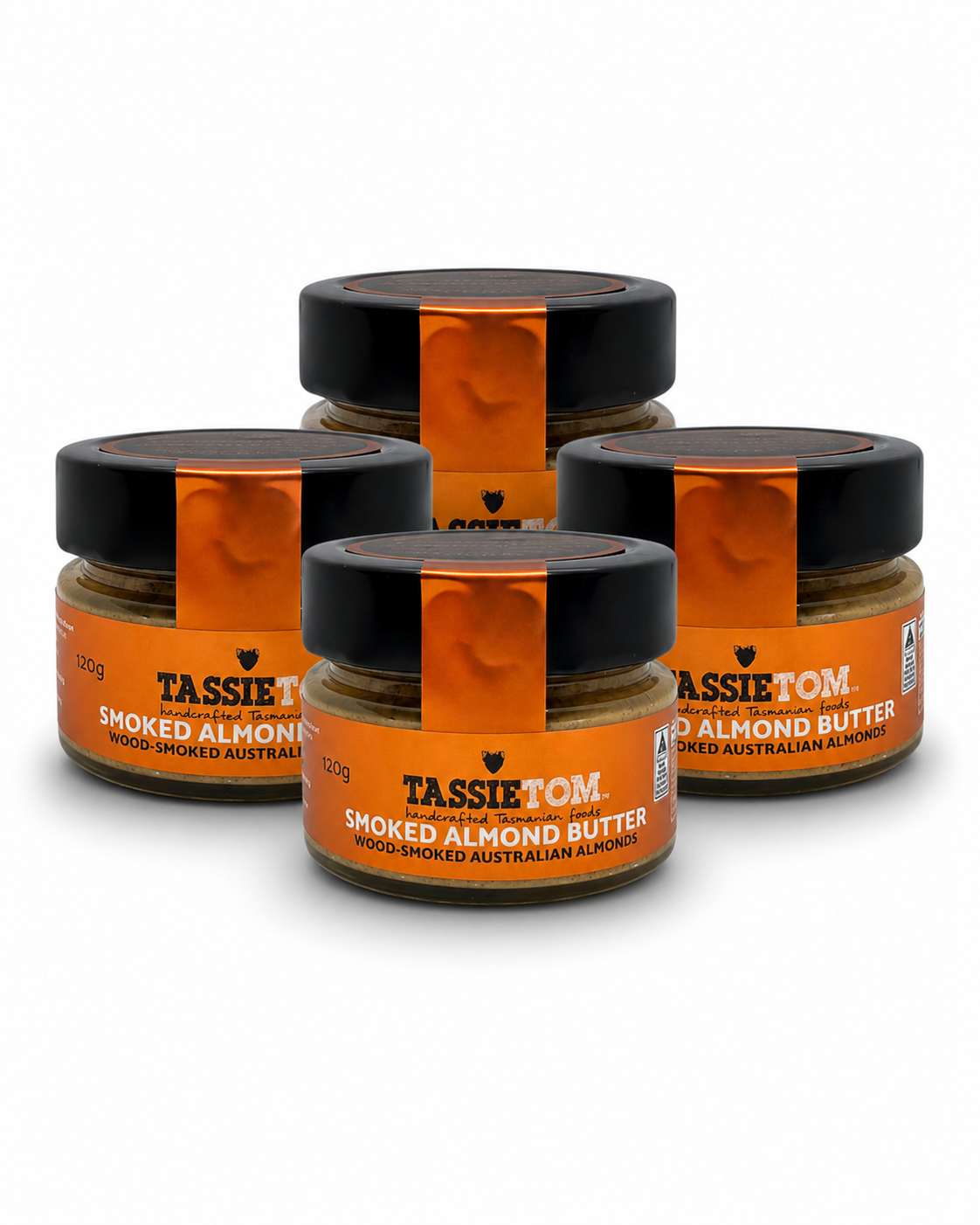 Four jars of Tassietom smoked almond butter on a white background