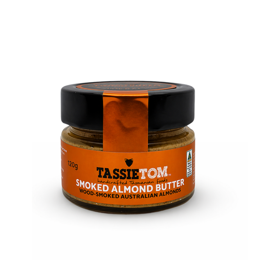 Jar of TassieTom smoked almond butter on a white background