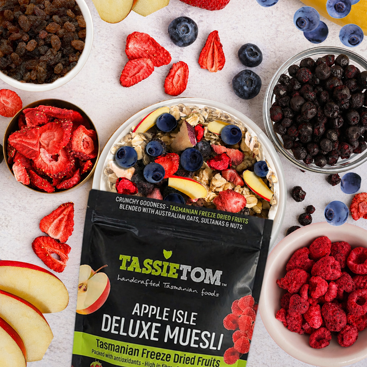 Apple Isle Dluxe Muesli with freeze dried Tasmanian fruit, oats and nuts displayed with ingredients in a flat lay
