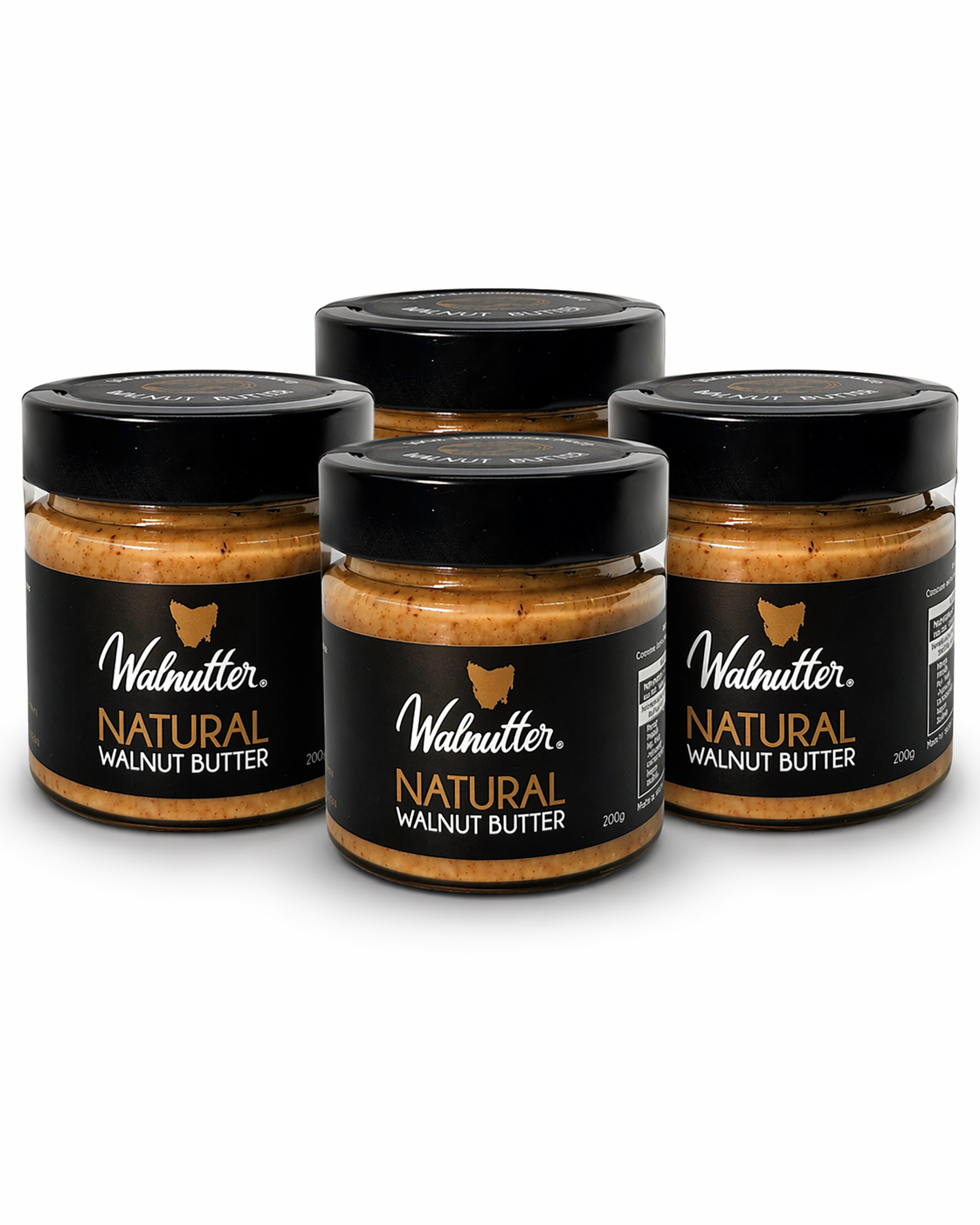 Four jars of Walnutter Natural Walnut Butter on a white background