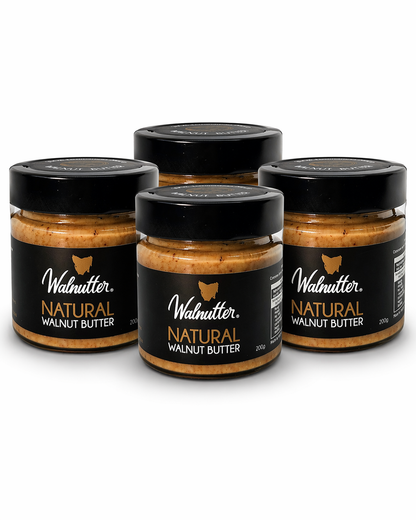 Four jars of Walnutter Natural Walnut Butter on a white background