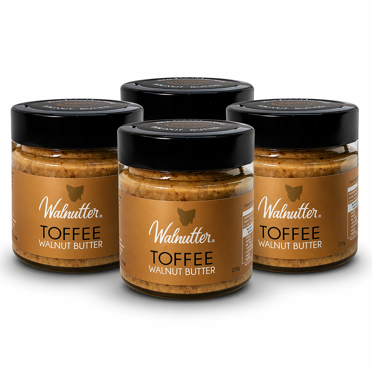 Four jars of Walnutter Toffee Walnut Butter on a white background
